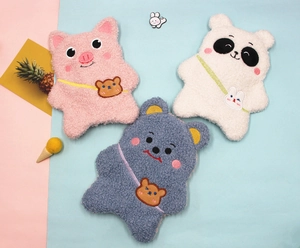 Detailed plush texture of cartoon pig, panda, and bear storage pouches in soft fleece