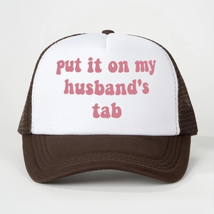 Detail of the pink script embroidery on the white front of the mesh baseball cap