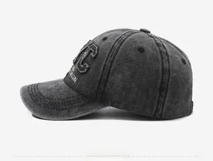 Side view of vintage dark gray washed denim baseball cap with NYC embroidery