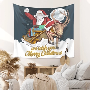 Detail of Christmas tapestry featuring Santa on a sleigh over a cozy bedroom bed