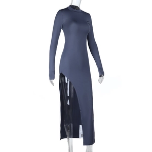 Detail of slim fit long sleeve dress showing high side slit and dark blue-grey elastic fabric