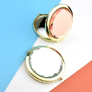 Dual-sided folding crystal makeup mirrors with gold metal frames on geometric backgrounds