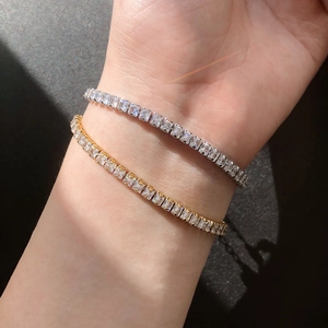 Elegant square-cut tennis bracelet in silver and gold finishes with sparkling cubic zirconia