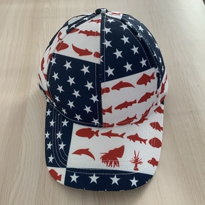 Unisex baseball cap with American flag stars and red fish print on a wooden background