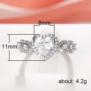Elegant heart-shaped halo silver ring with sparkling white cubic zirconia gems