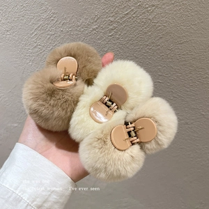 Three plush fur hair claws in brown, beige, and cream colors for autumn winter styling