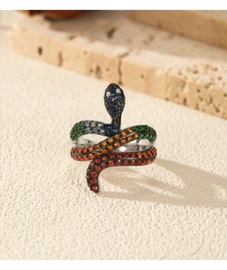 Macro detail of a snake ring featuring colorful gradient cubic zirconia pavé setting