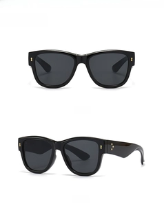 Front and 45 degree side views of oversized black cat eye sunglasses with star studs