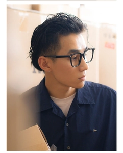 Side view of model wearing black oversized anti-blue light glasses with polished frames