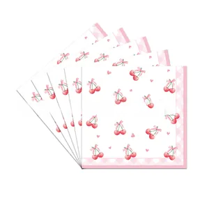 Macro detail of cherry and pink heart printed watercolor napkins for party table setting