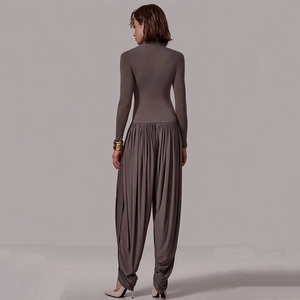 Slim fit dark grey long sleeve jumpsuit with high neck and draped harem style trousers back view