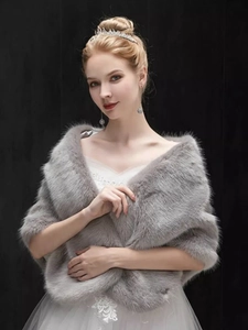 Detail of grey faux fur bridal shawl with soft texture and elegant winter wedding wrap