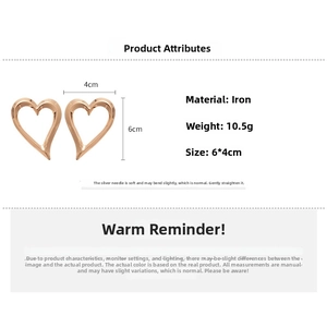 Detailed size specifications of gold heart-shaped hoop earrings showing 6cm by 4cm dimensions