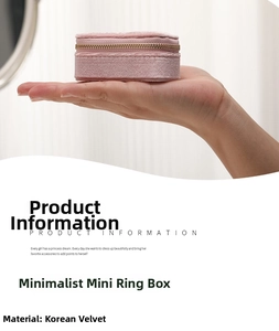 Close-up of pink velvet mini jewelry box for rings with palm-sized portable zipper design