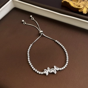 Detail of adjustable silver bracelet with marquise zircon butterfly and pavé diamonds