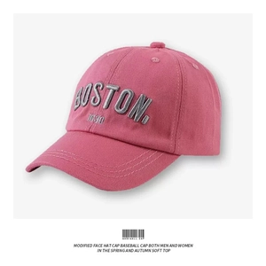 Close-up of pink cotton baseball cap featuring 3D grey BOSTON 1630 embroidery details