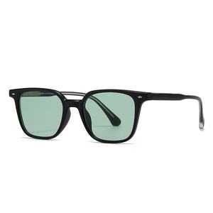 Retro vintage sunglasses with black frames and light green lenses in a 45-degree side view