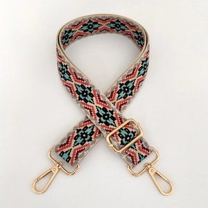 Detail of adjustable 3.8cm ethnic jacquard strap with gold metal lobster clasps