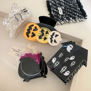 Halloween acetate hair claw set featuring ghost, pumpkin, and witch motifs with pearl luster
