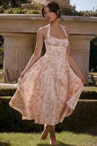 Detail of pink floral halter dress with corset-style cut and French vintage print