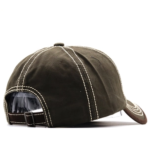 Detail view of cotton baseball cap with white contrast stitching and metal buckle strap