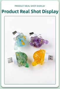 Macro detail of turtle night light made of resin with embedded crystal stones and gold foil