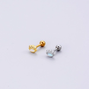 Detailed view of paw print stud earrings in gold and silver with opal inlay and ball back