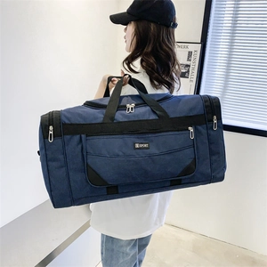 Detail of navy blue nylon travel bag showing spacious compartments and durable handles