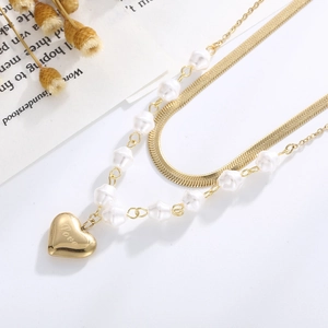 Double-layered gold titanium necklace with snake chain pearl strands and heart love pendant