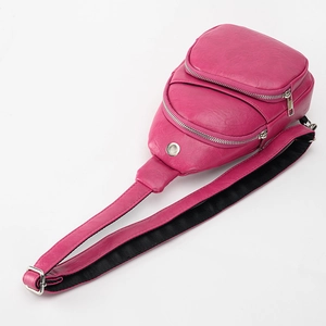 Minimalist rose red PU leather crossbody chest bag with adjustable strap and headphone port