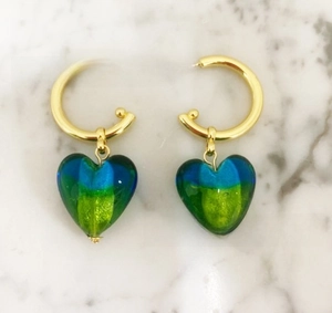 Detailed view of handmade heart-shaped Murano glass earrings with gold-plated hoops