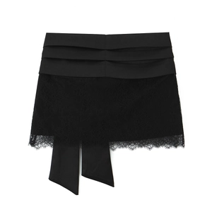 Elegant black lace mini skirt set with layered satin details and decorative ribbons