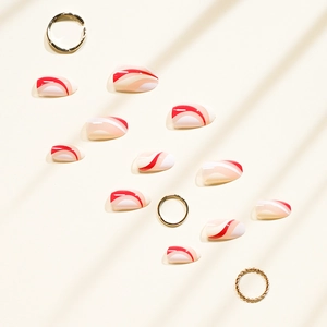Elegant French press-on nails with red and white wavy patterns and glossy finish