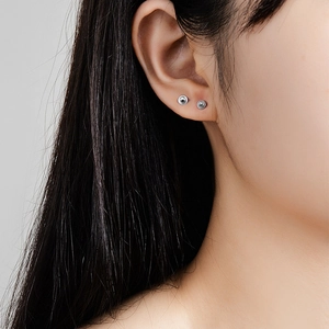Minimalist S925 sterling silver ball stud earrings worn by model for daily style