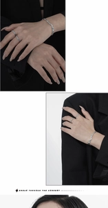 Close-up of S925 sterling silver irregular lava texture ring and bracelet on model