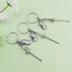 Fencing sport souvenir keychains with miniature masks and foils in silver alloy finish