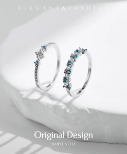 Detail of s925 silver rings with mint green and clear sparkling zircon stones