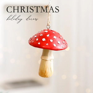 Red spotted mushroom Christmas ornament with twine hanging loop for holiday tree decor