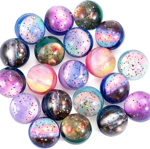 Vibrant starry sky bouncy balls with colorful nebula patterns and glitter on white background