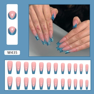Detail view of pink coffin-shaped press-on nails with blue glitter tips set of 24 pieces