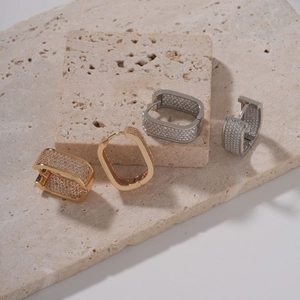 Fashion rectangular pave zircon hoop earrings in gold and silver finish on stone base