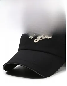 Detail of New York 3D embroidery on breathable black baseball cap with mesh fabric
