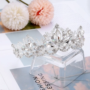 Detailed close-up of a silver bridal crown featuring brilliant zircons and floral motifs