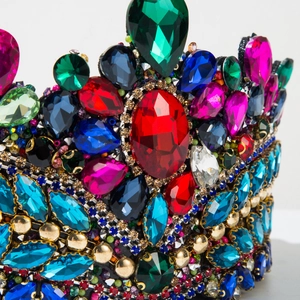 Macro shot of colorful rhinestones and gold beads on a luxury Baroque wedding crown