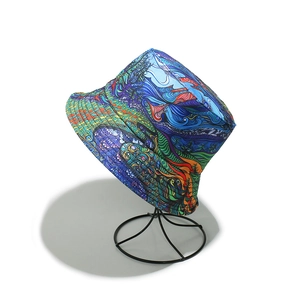 Artistic graffiti bucket hat with vibrant abstract print displayed on a black metal stand