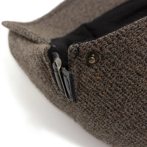 Brown herringbone tweed flat cap with leather side strap and vintage metal buckle detail