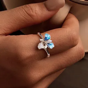 Elegant S925 silver iris flower ring with blue enamel and sparkling zircon accents