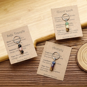 Handmade stone bead keychains with Tiger Eye and Sodalite on kraft card packaging