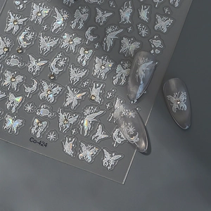 Holographic butterfly nail stickers with stars and crystal accents on silver gray nails