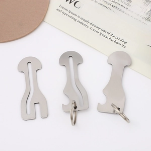Three silver stainless steel shopping cart tokens and keyrings on a white background